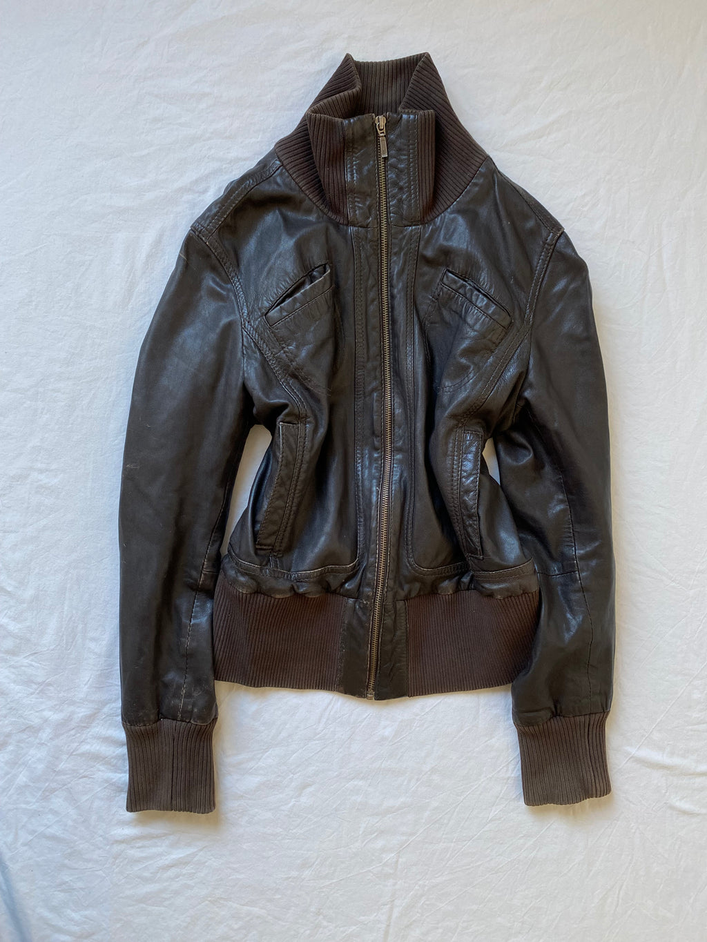Vintage genuine leather short bomber jacket with natural patina