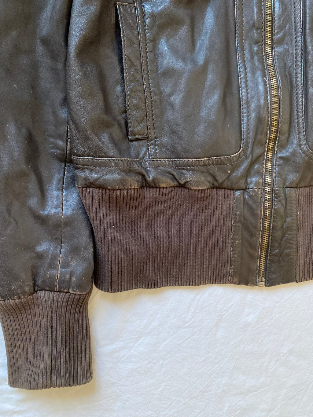 Vintage genuine leather short bomber jacket with natural patina