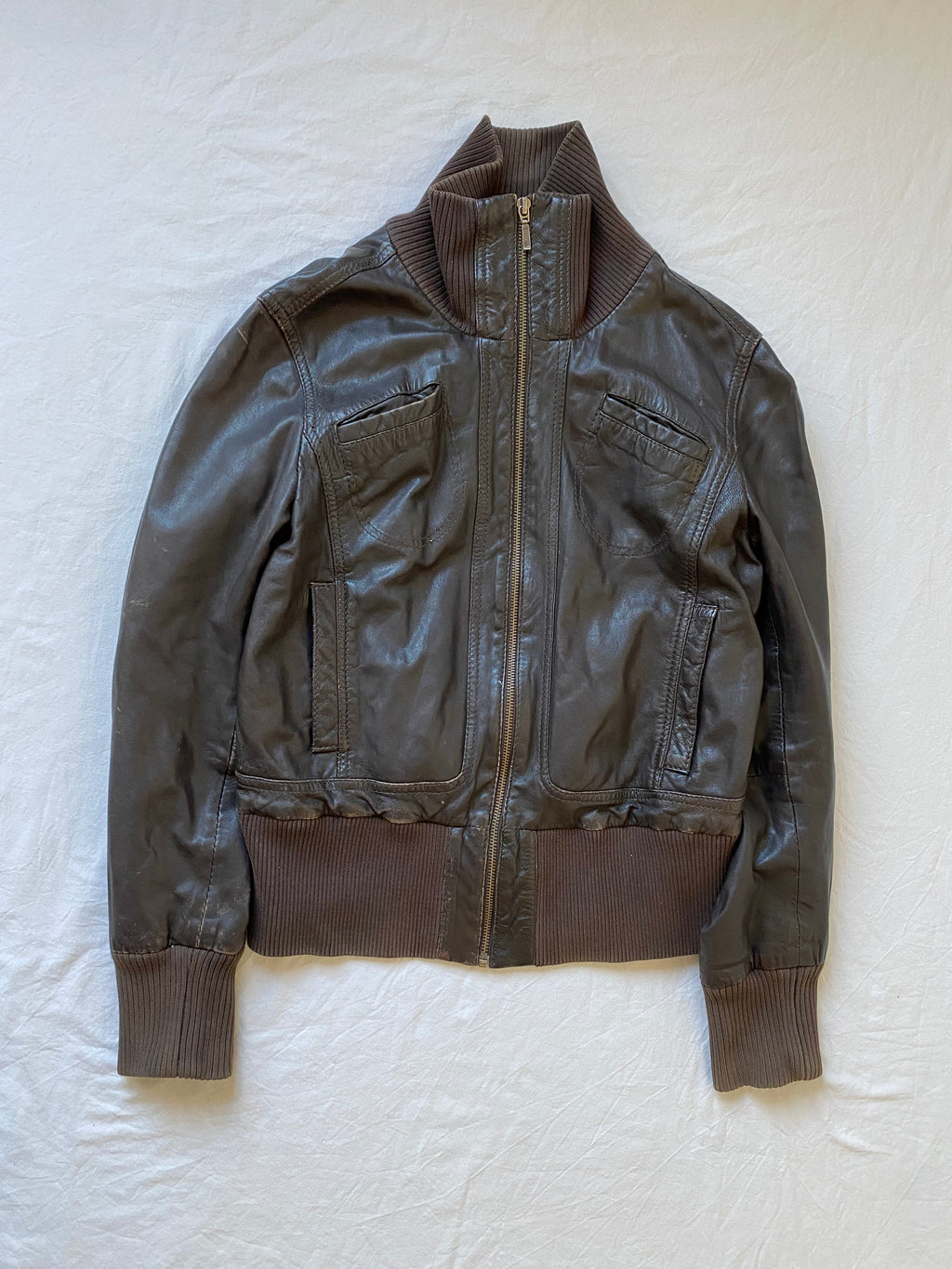 Vintage genuine leather short bomber jacket with natural patina